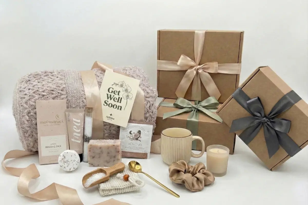 Get Well Soon gift basket with white knit blanket, gold ribbon, and greeting card for surgery recovery and sympathy care package in Dallas