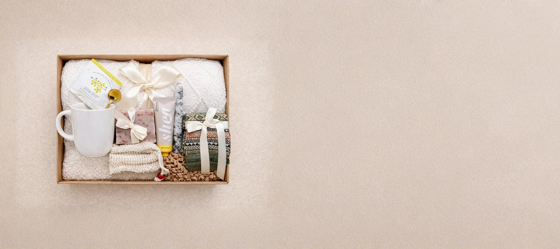 Luxury hand-crafted Mother's Day gift box with a cozy blanket, premium spa essentials, and personalized treats by Arinna Gifts Dallas.