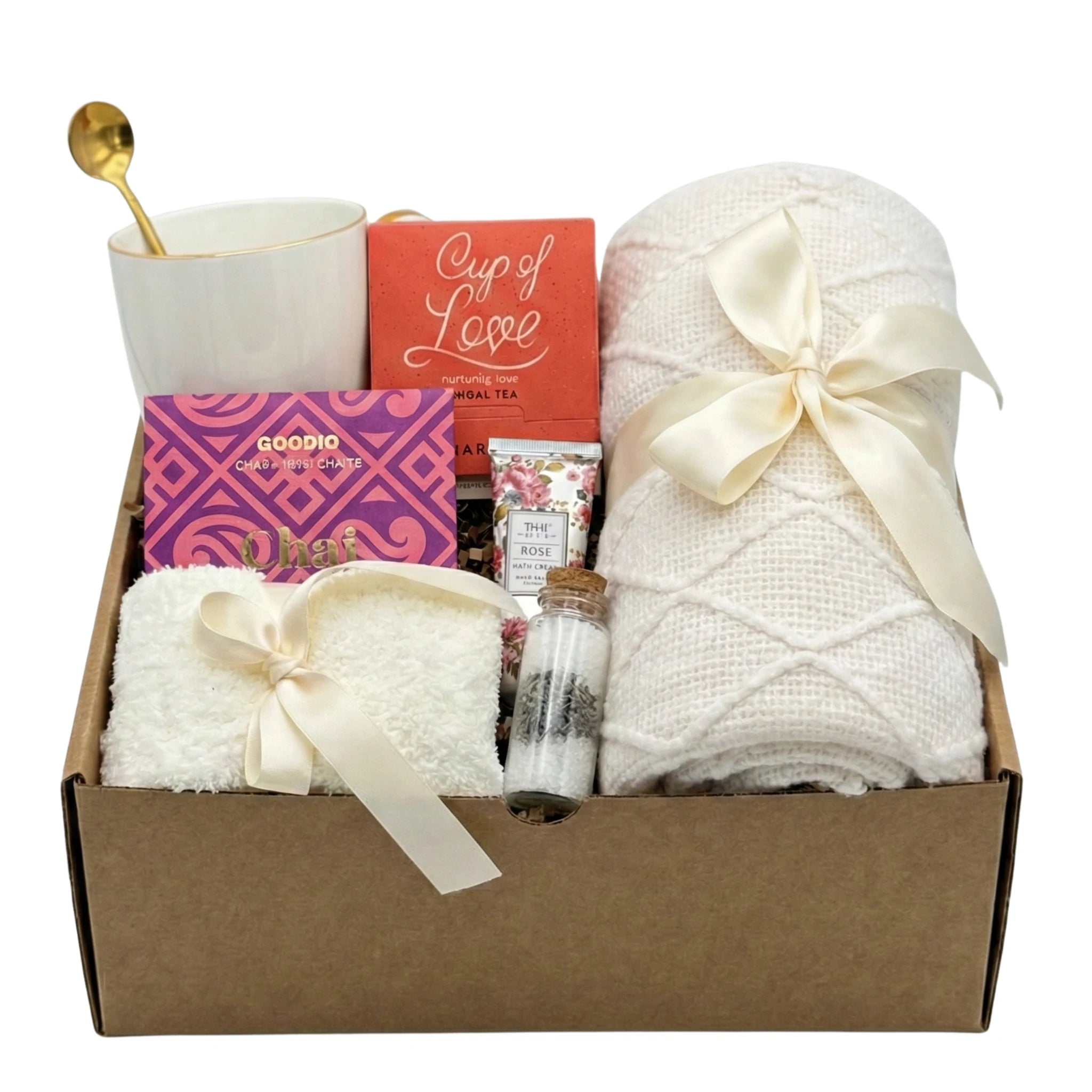 Affection gift basket with pink blanket, tea, and chocolate by Arinna Gifts in Dallas