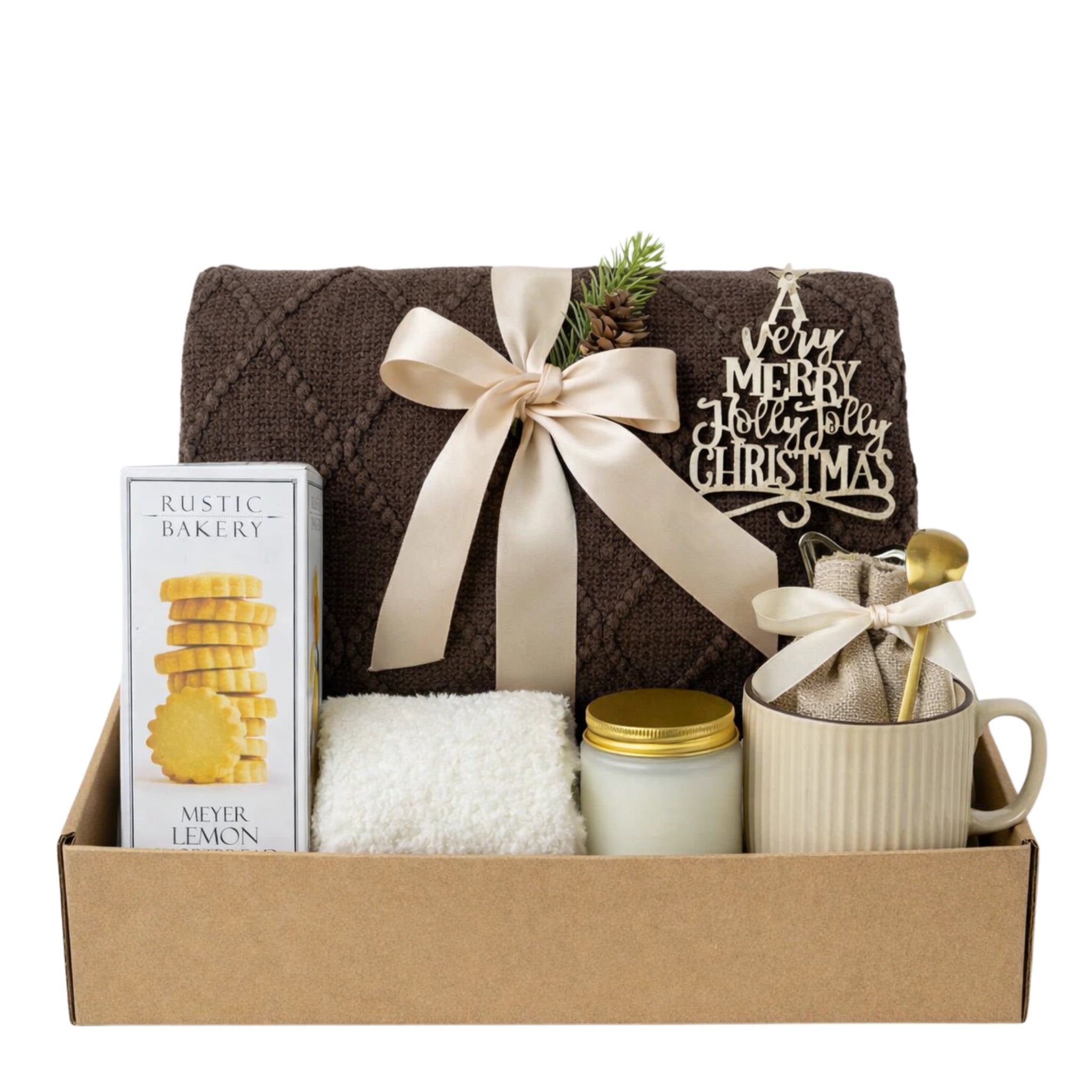 Christmas Morning Gift Box featuring brown knit throw blanket, Meyer Lemon cookies, glass jar candle, fluffy socks, ceramic mug with gold spoon and hot chocolate in burlap bag.