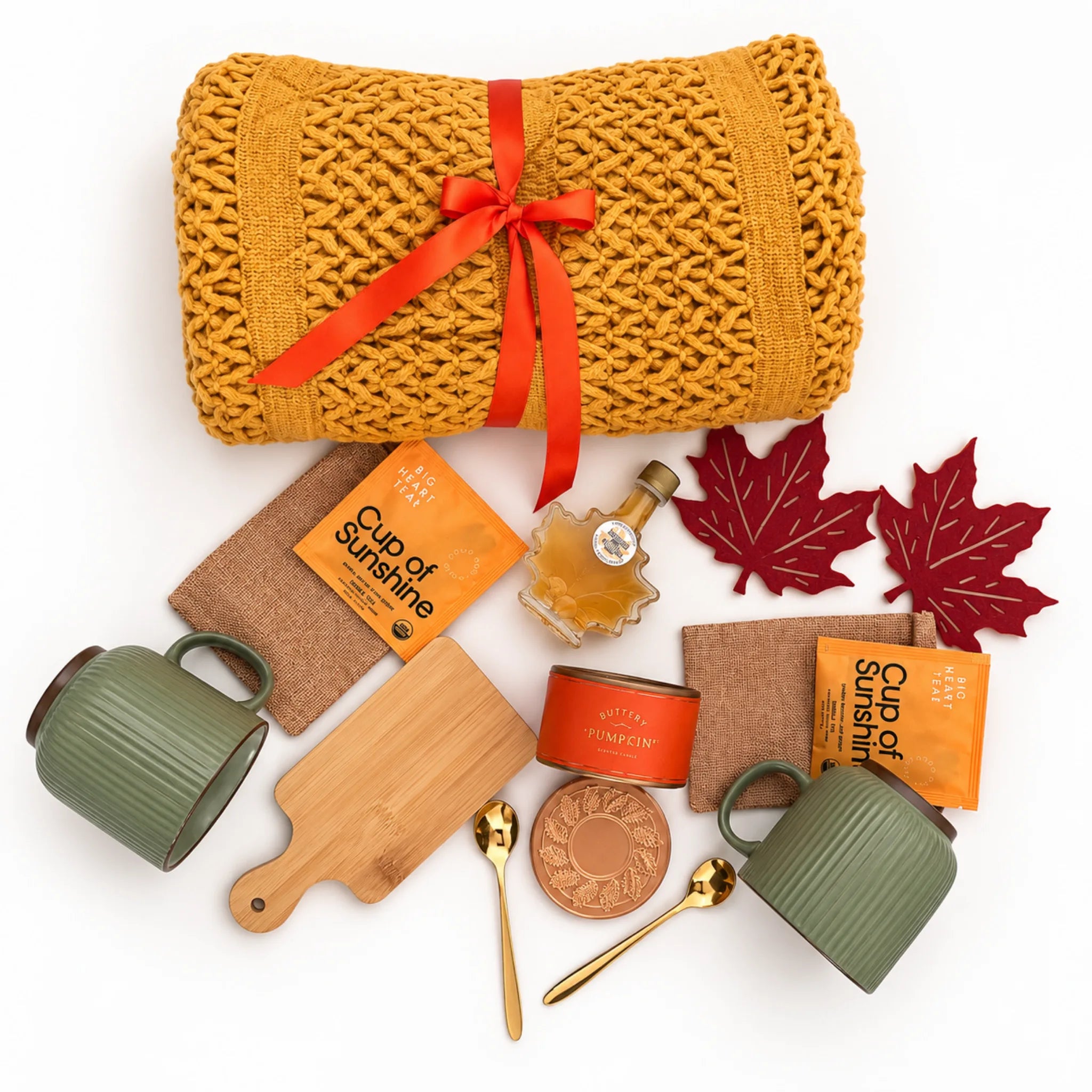Flat lay Fall Together gift box items showing chunky throw blanket, two green mugs, arinna gifts dallas tx