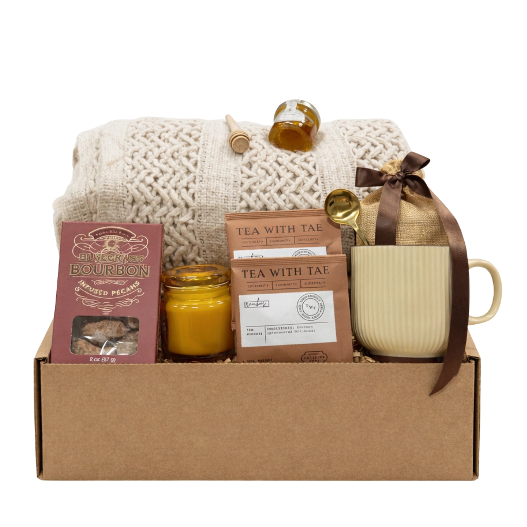 Quiet Comfort Gift Box thinking of you care package with cozy throw blanket, tea, honey, candle and mug arranged in a kraft gift box