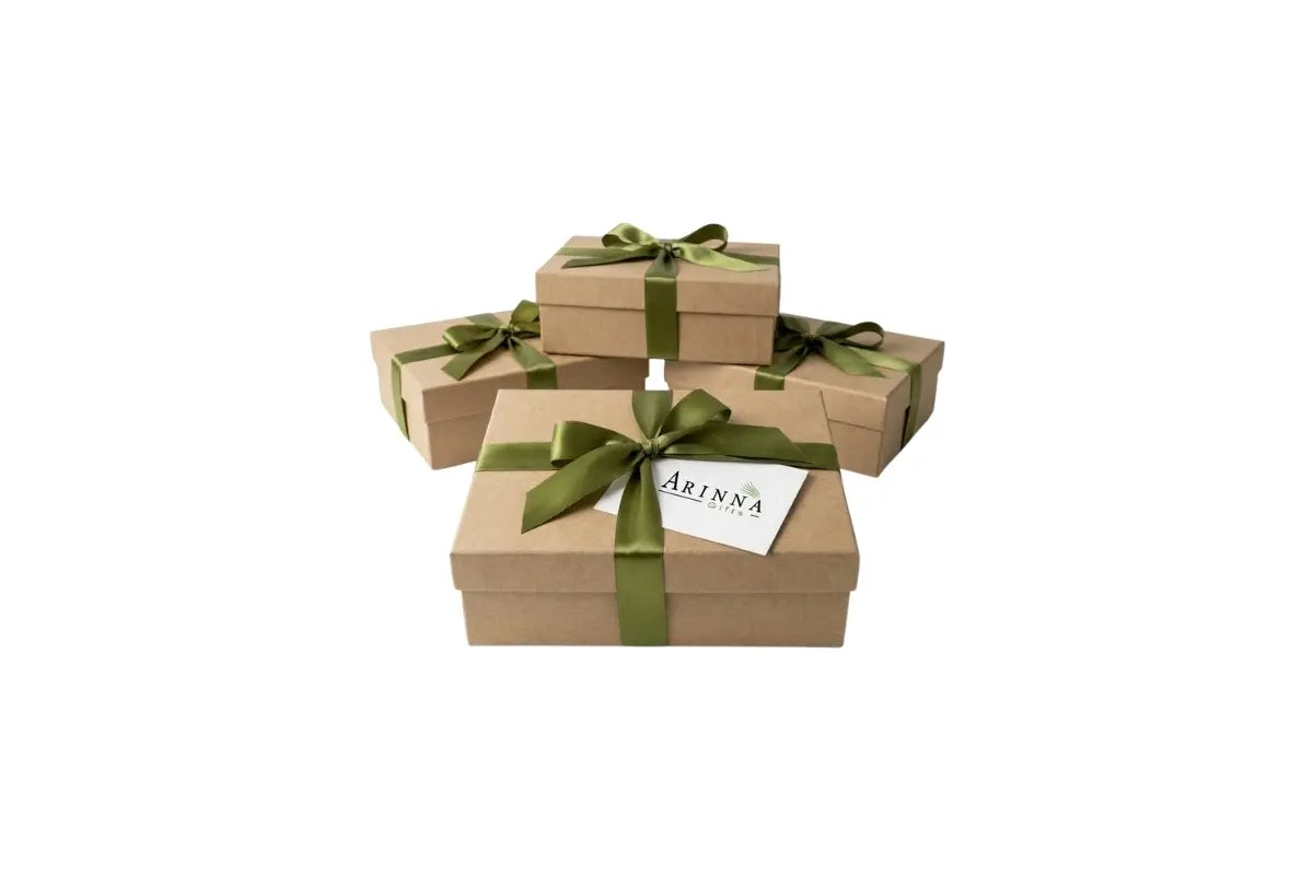 Custom corporate gift boxes with green ribbon and Arinna Gifts logo card ready for bulk delivery in Dallas