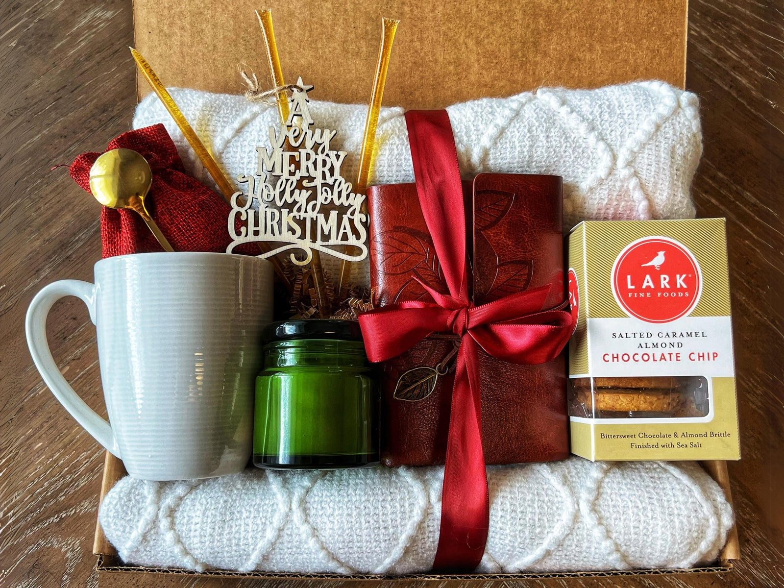 Christmas Gift Box for Women with red journal, salted caramel cookies and knit blanket by Arinna Gifts in Dallas
