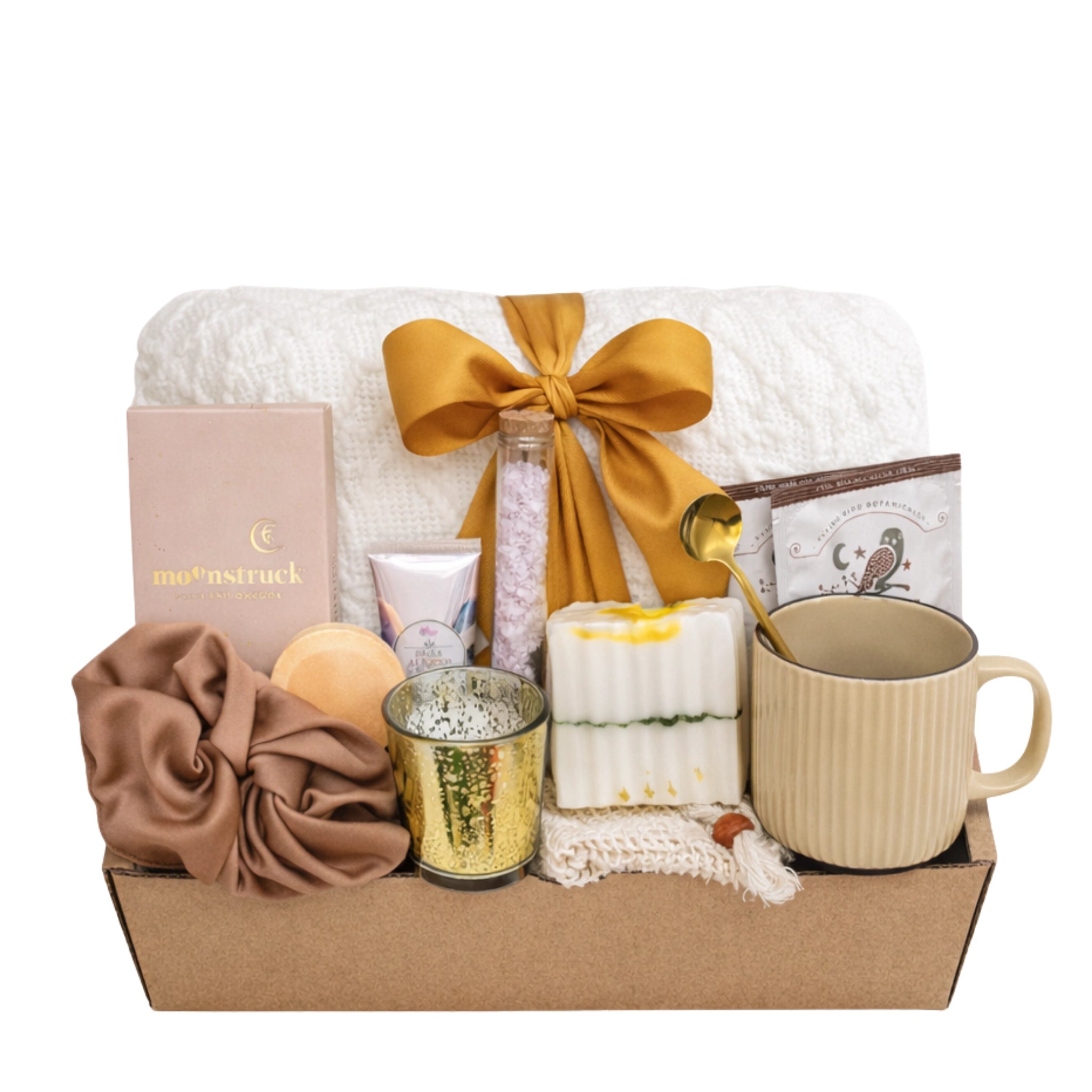 Send a Hug in a Box gift box for women featuring throw blanket, chocolate, candle, mug, herbal tea and spa self care items