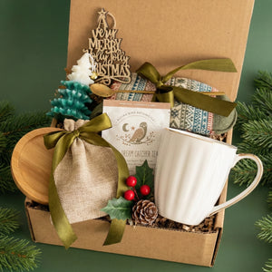 Top view of Silent Night box items including Coffee Mug, Nordic Socks, Christmas Tree Candle