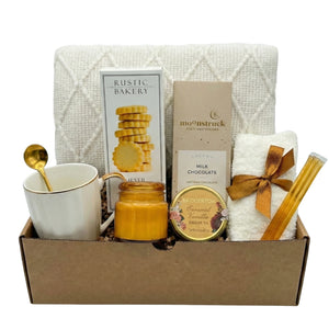 Beauty Cozy Life gift basket with white blanket, shortbread cookies and tea by Arinna Gifts in Dallas
