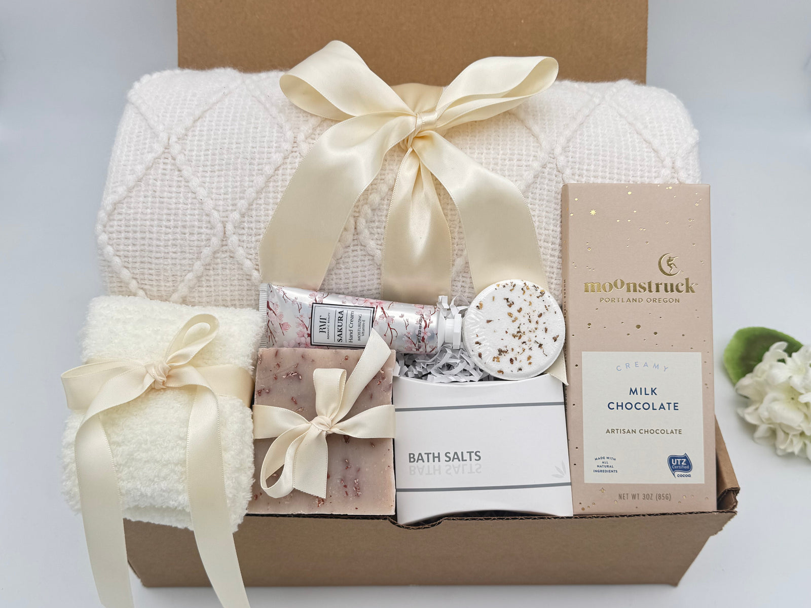 Spa gift box with blanket, socks, chocolate and bath treats