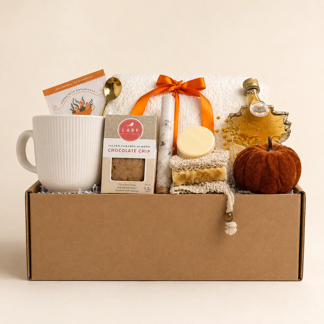 Hello Fall gift box with soft knit throw blanket, ribbed ceramic mug, maple leaf syrup, artisan soap, bath soak tube and velvet pumpkin for autumn care package