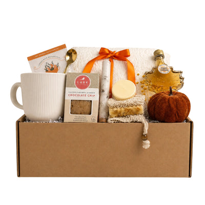 Hello Fall gift box with soft knit throw blanket, ribbed ceramic mug, maple leaf syrup, artisan soap, bath soak tube and velvet pumpkin for autumn care package