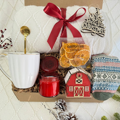 Magic of Christmas Gift Box with White Knitted Throw Blanket, Coffee Mug and Nordic Socks by Arinna Gifts in Dallas
