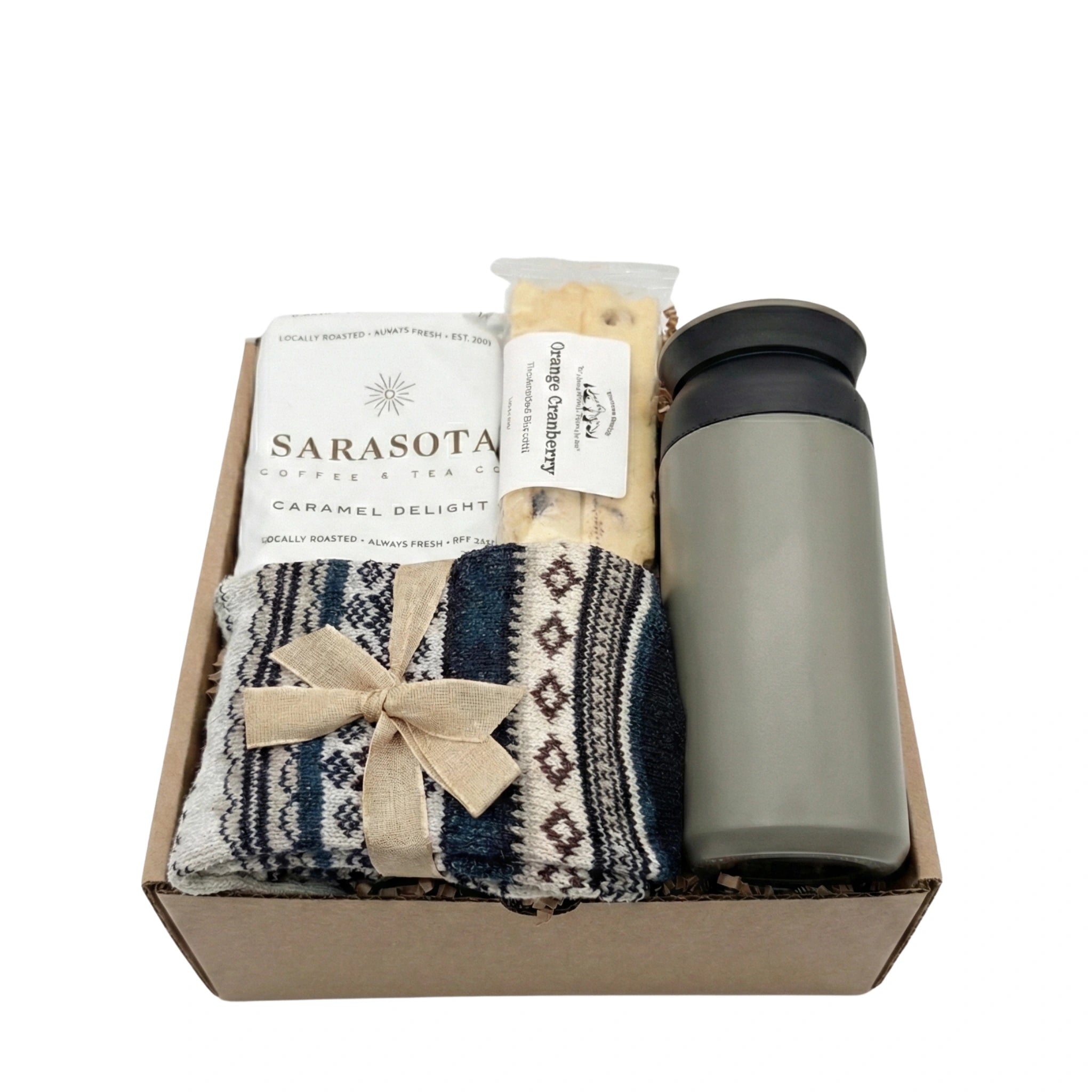 Nordic Warmth gift box featuring grey travel tumbler, caramel coffee, and wool socks by Arinna Gifts Dallas