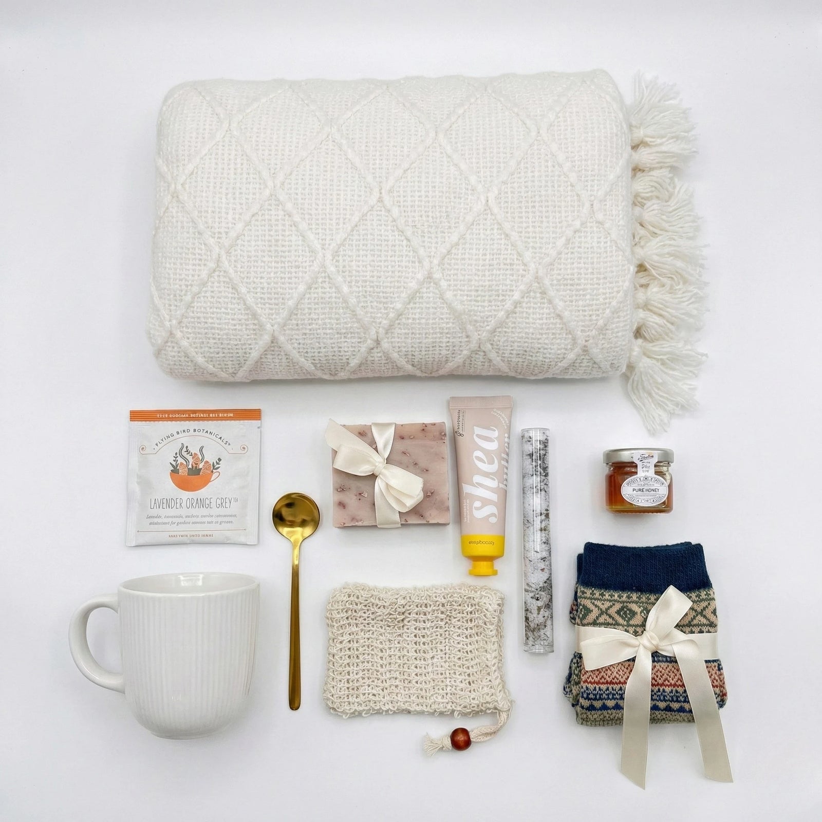 Rejuvenate gift box featuring herbal tea, honey, artisan soap, and cozy blanket by Arinna Gifts Dallas