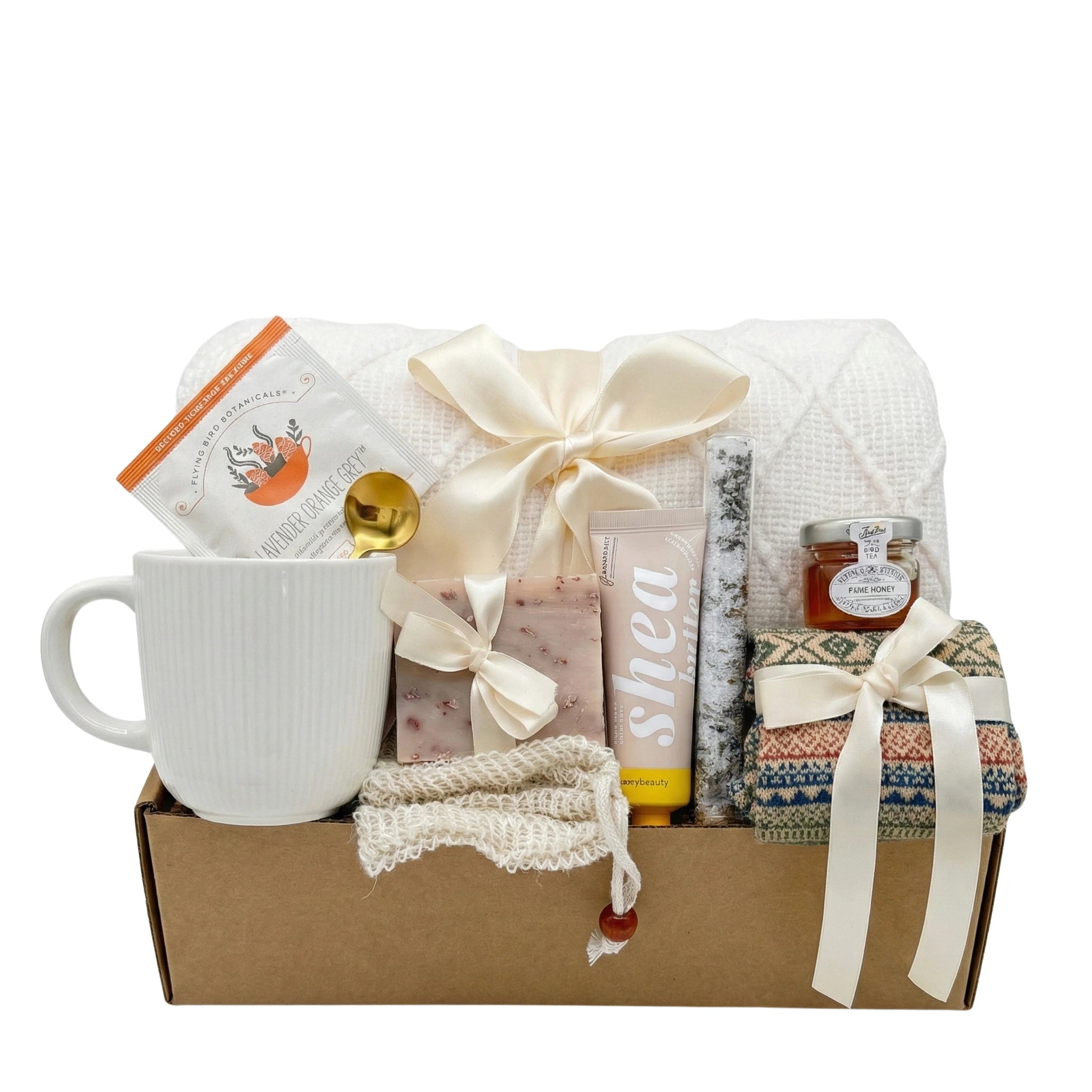 Rejuvenate gift box featuring herbal tea, honey, artisan soap, and cozy blanket by Arinna Gifts Dallas