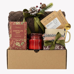 Santa Baby gift basket with brown blanket, chai tea and red candle by Arinna Gifts in Dallas