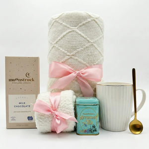 Sending Love and Hug gift box with white blanket, tea and fluffy socks by Arinna Gifts in Dallas