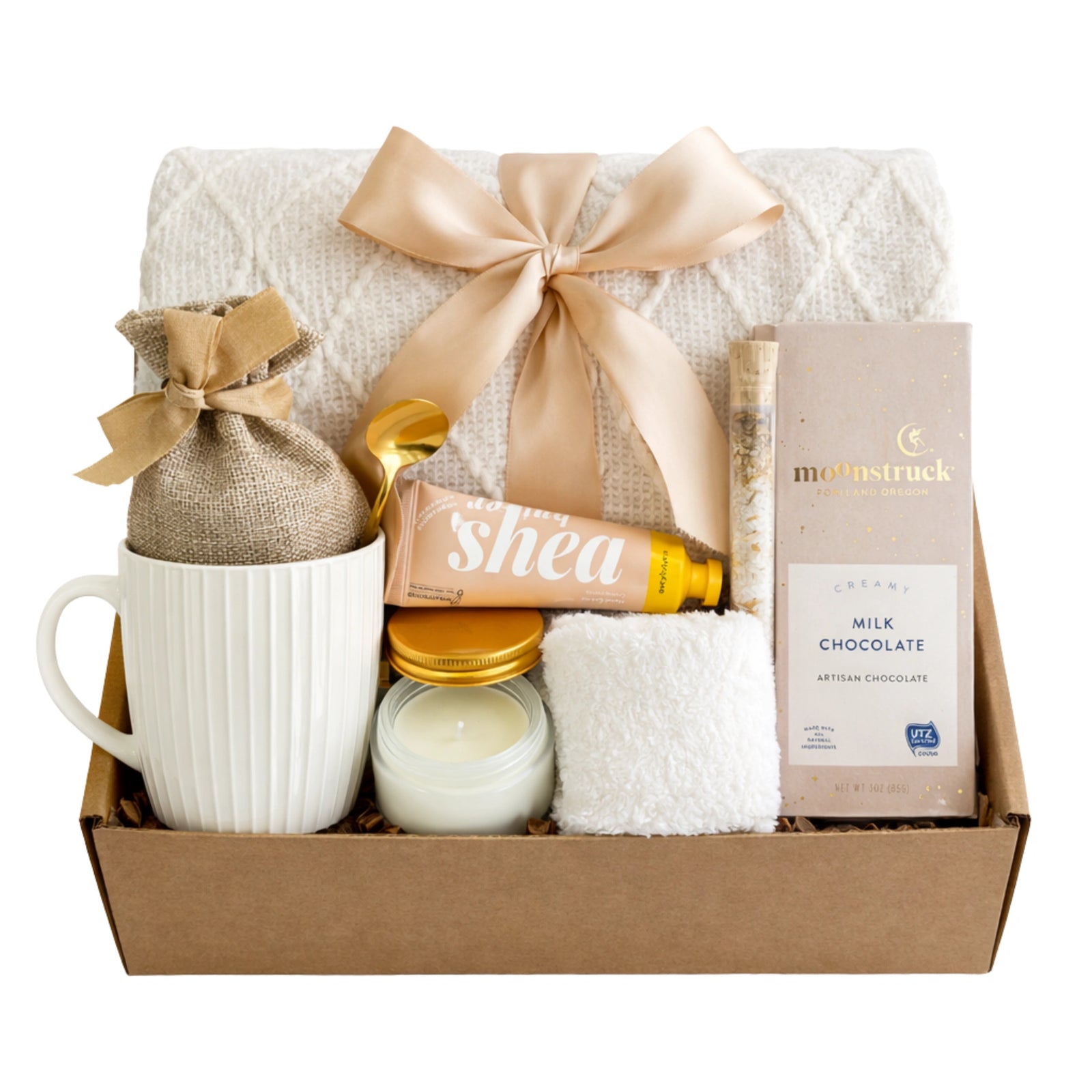 Serenity gift box featuring white knit blanket, shea cream, and Moonstruck chocolate by Arinna Gifts Dallas