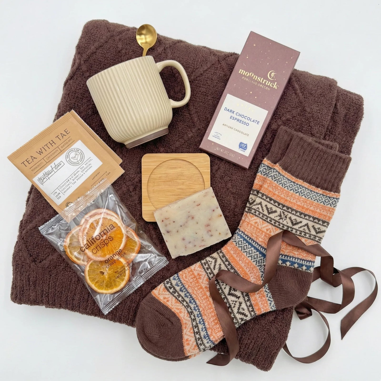 Simple Pleasures rustic gift basket with brown blanket, chocolate and dried oranges by Arinna Gifts in Dallas